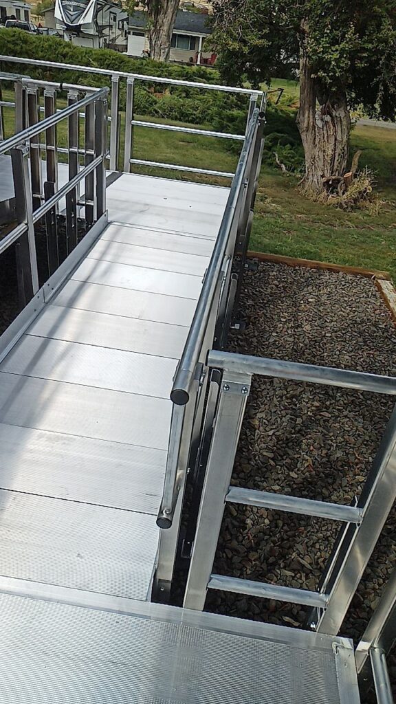 A modern, clean, stainless steel ramp with multiple angles.