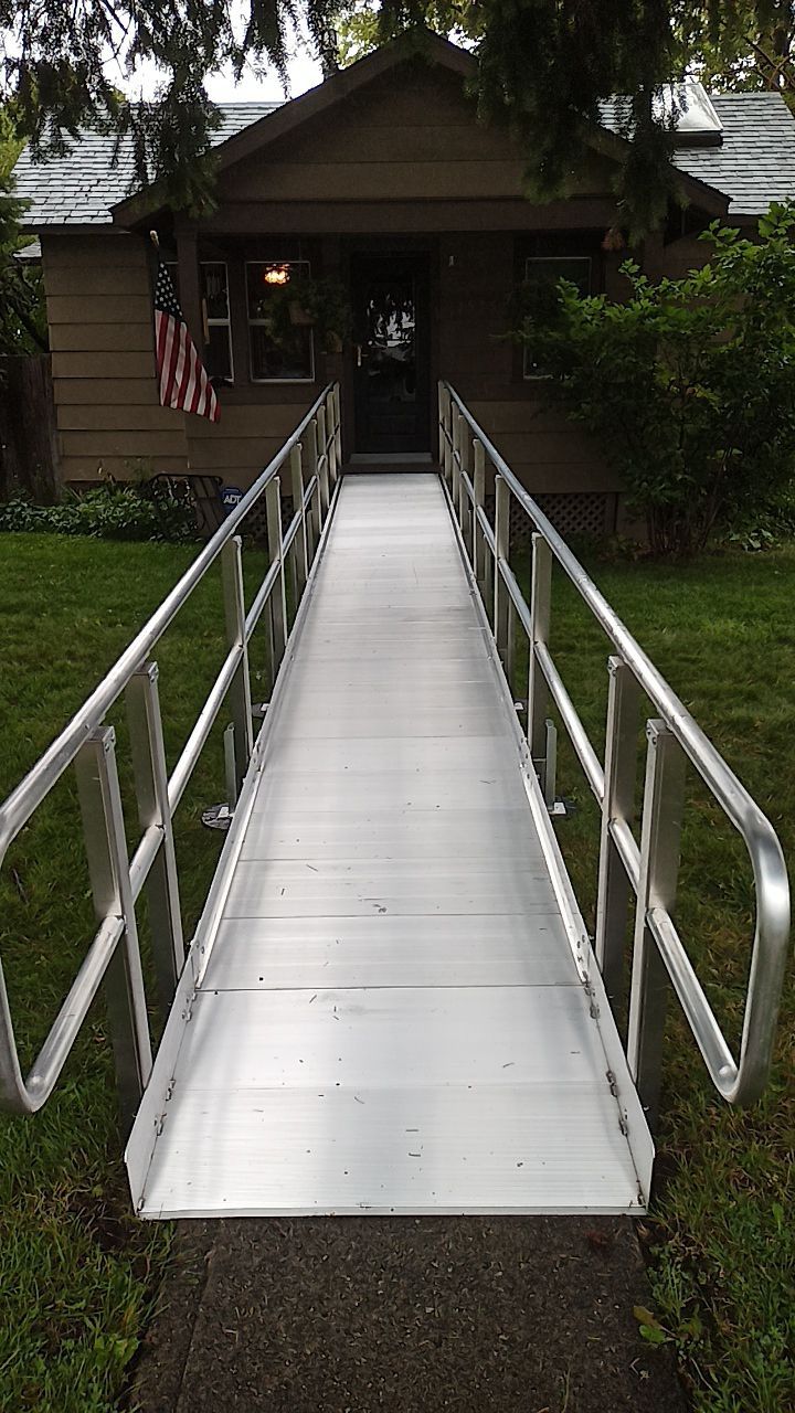 A straight, long stainless steel ramp.