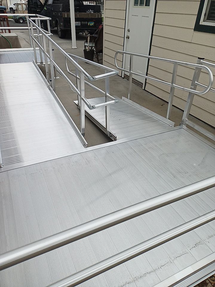 A multi-angled stainless steep ramp with a flat mid-landing.