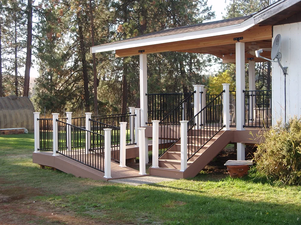 A custom deck with both stairs and a ramp right beside one another.