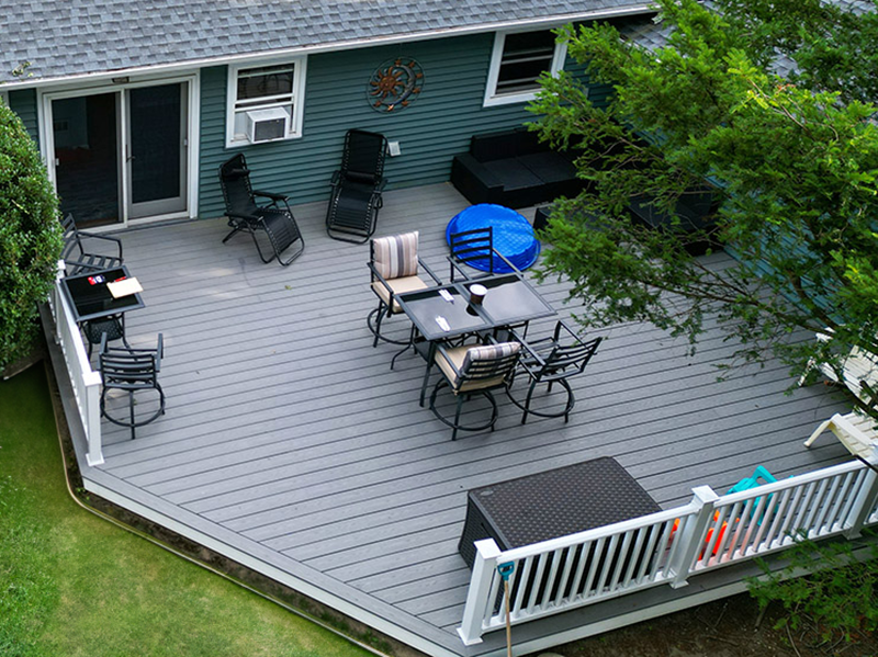 The back deck of a home made of composite wood.